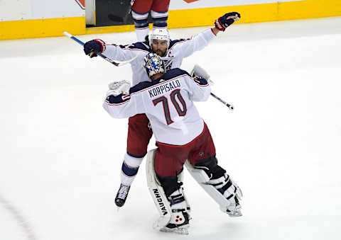 TORONTO, ONTARIO – AUGUST 02: Nick Foligno #71 of the Columbus Blue Jackets congratulates Joonas Korpisalo #70 after shutting out the Toronto Maple Leafs 2-0 in Game One of the Eastern Conference Qualification Round prior to the 2020 NHL Stanley Cup Playoffs at Scotiabank Arena on August 02, 2020 in Toronto, Ontario, Canada. (Photo by Andre Ringuette/Freestyle Photo/Getty Images)