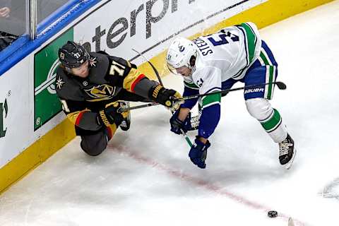 William Karlsson #71 of the Vegas Golden Knights battles for the puck with Troy Stecher #51 of the Vancouver Canucks during the second period in Game Two of the Western Conference Second Round. (Photo by Bruce Bennett/Getty Images)