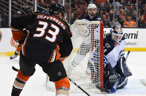 Mar 24, 2017; Anaheim, CA, USA; Winnipeg Jets goalie Michael Hutchinson (34) defends the net from Anaheim Ducks right wing Jakob Silfverberg (33) in the first period of the game at Honda Center. Mandatory Credit: Jayne Kamin-Oncea-USA TODAY Sports