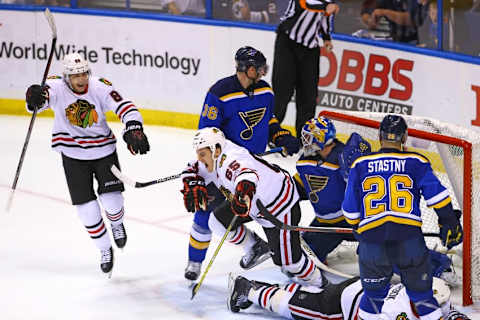 Apr 15, 2016; St. Louis, MO, USA; Chicago Blackhawks center Andrew Shaw (65) celebrates with teammate Patrick Kane (88) after scoring a goal against St. Louis Blues goalie Brian Elliott (1) during the third period in game two of the first round of the 2016 Stanley Cup Playoffs at Scottrade Center. The Blackhawks won the game 3-2. Mandatory Credit: Billy Hurst-USA TODAY Sports