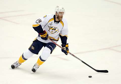 Jun 8, 2017; Pittsburgh, PA, USA; Nashville Predators defenseman Mattias Ekholm (14) moves the puck against the Pittsburgh Penguins during the second period in game five of the 2017 Stanley Cup Final at PPG PAINTS Arena. Mandatory Credit: Charles LeClaire-USA TODAY Sports