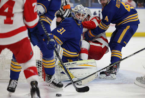 Nov 6, 2021; Buffalo, New York, USA; Buffalo Sabres goaltender Dustin Tokarski (31) looks for the puck against the Detroit Red Wings during the third period at KeyBank Center. Mandatory Credit: Timothy T. Ludwig-USA TODAY Sports