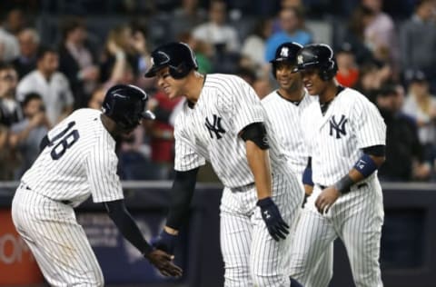 May 2, 2017; Bronx, NY, USA; New York Yankees shortstop Didi Gregorius (18) and right fielder Aaron Judge (99) celebrate in the seventh inning after scoring against the Toronto Blue Jays at Yankee Stadium. Mandatory Credit: Noah K. Murray-USA TODAY Sports