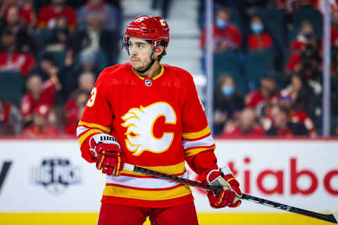 Dec 9, 2021; Calgary, Alberta, CAN; Calgary Flames left wing Johnny Gaudreau (13) against the Carolina Hurricanes during the first period at Scotiabank Saddledome. Mandatory Credit: Sergei Belski-USA TODAY Sports