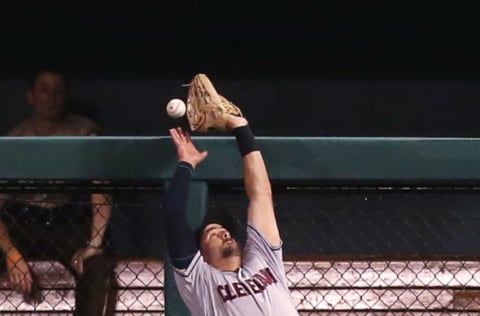 Cleveland Indians right fielder Lonnie Chisenhall is unable to catch a solo home run by the St. Louis Cardinals’ Matt Carpenter in the first inning at Busch Stadium in St. Louis on Tuesday, June 26, 2018. (Chris Lee/St. Louis Post-Dispatch/TNS via Getty Images)