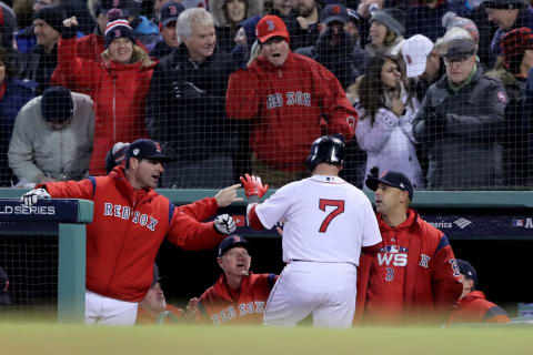 BOSTON, MA – OCTOBER 24: Christian Vazzquez #7 is congratulated by manager Alex Corra #20 of the Boston Red Sox after scoring a run during the fifth inning against the Los Angeles Dodgers in Game Two of the 2018 World Series at Fenway Park on October 24, 2018 in Boston, Massachusetts. (Photo by Elsa/Getty Images)