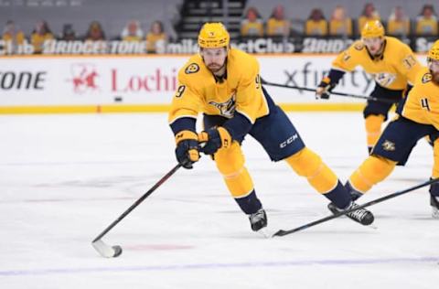 Feb 9, 2021; Nashville, Tennessee, USA; Nashville Predators left wing Filip Forsberg (9) skates against the Tampa Bay Lightning during the first period at Bridgestone Arena. Mandatory Credit: Steve Roberts-USA TODAY Sports