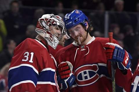 NHL Power Rankings: Montreal Canadiens goalie Carey Price (31) reacts with teammate Jeff Petry (26) after defeating the Anaheim Ducks 5-1 at the Bell Centre. Mandatory Credit: Eric Bolte-USA TODAY Sports