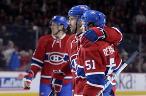 NHL Team Name Origins: Montreal Canadiens forward David Desharnais (51) reacts with teammates including Tomas Plekanec (14) after scoring a goal against the Florida Panthers during the second period at the Bell Centre. Mandatory Credit: Eric Bolte-USA TODAY Sports