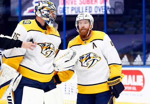 Nashville Predators goaltender Pekka Rinne (35) and Nashville Predators defenseman Ryan Ellis (4) Mandatory Credit: Kim Klement-USA TODAY Sports