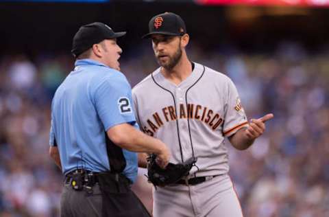 LOS ANGELES, CA – JUNE 16: San Francisco Giants starting pitcher Madison Bumgarner (40) questions a tip ball call by umpire Dan Bellino (2) during the game between the San Francisco Giants and the Los Angeles Dodgers on June 16, 2018, at Dodger Stadium in Los Angeles, CA. (Photo by David Dennis/Icon Sportswire via Getty Images)