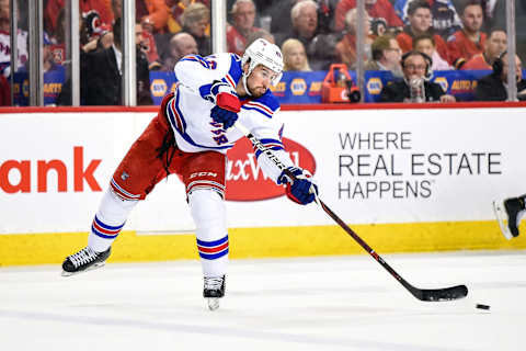 CALGARY, AB – MARCH 15: New York Rangers Defenceman Brendan Smith (42) passes the puck during the second period of an NHL game where the Calgary Flames hosted the New York Rangers on March 15, 2019, at the Scotiabank Saddledome in Calgary, AB. (Photo by Brett Holmes/Icon Sportswire via Getty Images)