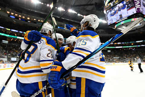 PITTSBURGH, PENNSYLVANIA – DECEMBER 17: Zemgus Girgensons #28 of the Buffalo Sabres celebrates his goal with teammates during the second period of a game against the Pittsburgh Penguins at PPG PAINTS Arena on December 17, 2021 in Pittsburgh, Pennsylvania. (Photo by Emilee Chinn/Getty Images)