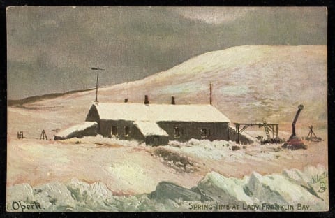 "Spring-time at Lady Franklin Bay" is the title of this painting by Albert Operti, seen here in postcard form. The caption on the reverse of the postcard reads, "The building shown is Fort Conger in Lady Franklin Bay, as Commander Peary found it eighteen years after its abandonment by the Greely Party 1881-1883. The cairn in sight is the one reared by the Nares Expedition in 1875. The Discovery party wintered here."