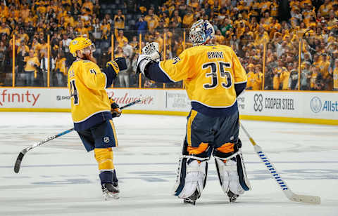 NASHVILLE, TN – APRIL 12: Ryan Ellis #4 congratulates Pekka Rinne #35 of the Nashville Predators on a 5-2 win against the Colorado Avalanche in Game One of the Western Conference First Round during the 2018 NHL Stanley Cup Playoffs at Bridgestone Arena on April 12, 2018 in Nashville, Tennessee. (Photo by John Russell/NHLI via Getty Images)