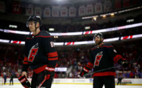 RALEIGH, NORTH CAROLINA – MAY 30: Martin Necas #88 and Jordan Martinook #48 of the Carolina Hurricanes exit the ice following their 6-2 defeat against the New York Rangers in Game Seven of the Second Round of the 2022 Stanley Cup Playoffs at PNC Arena on May 30, 2022 in Raleigh, North Carolina. (Photo by Jared C. Tilton/Getty Images)