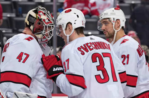 DETROIT, MI – NOVEMBER 24: Goaltender James Reimer #47 of the Carolina Hurricanes is congratulated by teammates Andrei Svechnikov #37 and Nino Niederreiter #21 following an NHL game against the Detroit Red Wings at Little Caesars Arena on November 24, 2019 in Detroit, Michigan. Carolina defeated Detroit 2-0. (Photo by Dave Reginek/NHLI via Getty Images)