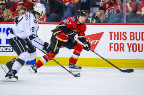 Mar 29, 2017; Calgary, Alberta, CAN; Calgary Flames center Sam Bennett (93) controls the puck in front of Los Angeles Kings defenseman Drew Doughty (8) during the third period at Scotiabank Saddledome. Los Angeles Kings won 4-1. Mandatory Credit: Sergei Belski-USA TODAY Sports