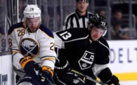 Feb 27, 2016; Los Angeles, CA, USA; Los Angeles Kings left wing Kyle Clifford (13) battles with Buffalo Sabres center Zemgus Girgensons (28) for the puck in the first period of the game at Staples Center. Mandatory Credit: Jayne Kamin-Oncea-USA TODAY Sports