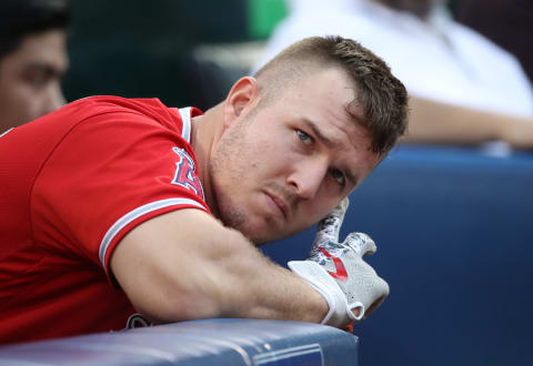 TORONTO, ON – MAY 23: Mike Trout #27 of the Los Angeles Angels of Anaheim gets ready to bat from the corner of the dugout during MLB game action against the Toronto Blue Jays at Rogers Centre on May 23, 2018, in Toronto, Canada. (Photo by Tom Szczerbowski/Getty Images) *** Local Caption *** Mike Trout