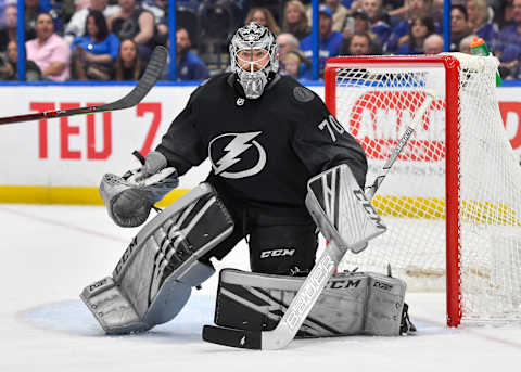 TAMPA, FL – MARCH 09: Tampa Bay Lightning goalie Louis Domingue (70) tracks the puck during the second period of an NHL game between the Detroit Red Wings and the Tampa Bay Lightning on March 09, 2019 at Amalie Arena in Tampa, FL. (Photo by Roy K. Miller/Icon Sportswire via Getty Images)