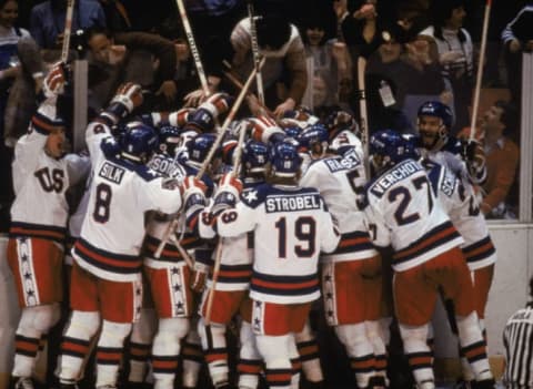 Team USA celebrates their 4-3 victory over the Soviet Union in the semi-final Men's Ice Hockey event at the Winter Olympic Games in Lake Placid, New York on February 22, 1980.