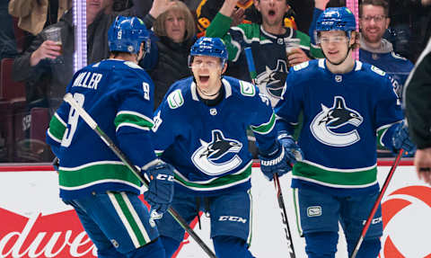 VANCOUVER, BC – APRIL 14: Alex Chiasson #39 of the Vancouver Canucks celebrates with teammates J.T. Miller #9 and Vasily Podkolzin #92 after scoring a goal against the Phoenix Coyotes during the first period at Rogers Arena on April 14, 2022in Vancouver, British Columbia, Canada. (Photo by Rich Lam/Getty Images)