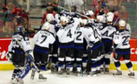 CALGARY, CANADA – JUNE 5: The Tampa Bay Lightning celebrate after teammate Martin St. Louis #26 scored the team’s game winning goal during the second overtime in game six of the NHL Stanley Cup Finals on June 5, 2004 at the Pengrowth Saddledome in Calgary, Canada. The Lightning won 3-2. (Photo by Jeff Vinnick/Getty Images)