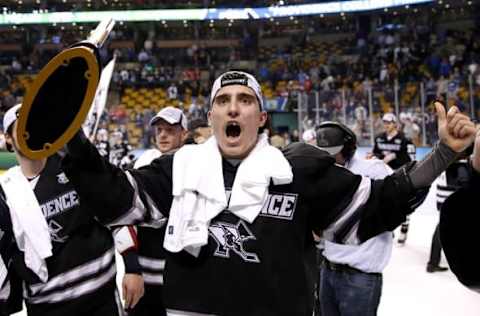 Apr 11, 2015; Boston, MA, USA; Providence College Friars forward Brandon Tanev (22), who scored the game winning goal, celebrates with the trophy after defeating the Boston University Terriers 4-3 in the championship game of the Frozen Four college ice hockey tournament at TD Garden. Mandatory Credit: Winslow Townson-USA TODAY Sports