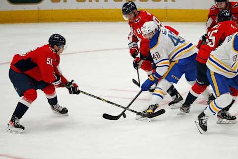 Sep 25, 2022; Washington, District of Columbia, USA; Buffalo Sabres center Tyson Kozak (48) battles for the puck with Washington Capitals defenseman Dru Krebs (51) and Washington Capitals left wing Alex Ovechkin (8) during the second period at Capital One Arena. Mandatory Credit: Amber Searls-USA TODAY Sports