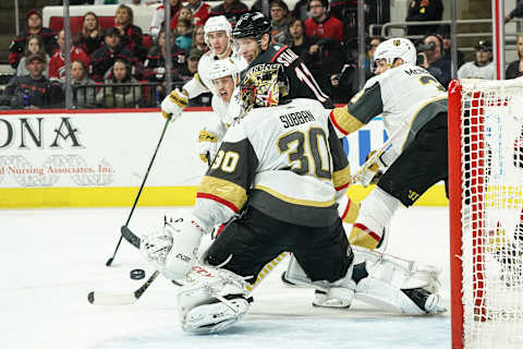 RALEIGH, NC – JANUARY 31: Carolina Hurricanes Center Jordan Staal (11) throws a puck in front of Vegas Golden Knights Goalie Malcolm Subban (30) during a game between the Carolina Hurricanes and the Las Vegas Golden Knights on January 31, 2020 at the PNC Arena in Raleigh, NC. (Photo by Greg Thompson/Icon Sportswire via Getty Images)