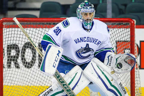 Feb 14, 2015; Calgary, Alberta, CAN; Vancouver Canucks goalie Ryan Miller (30) guards his net during the warmup period against the Calgary Flames at Scotiabank Saddledome. Calgary Flames won 3-2. Mandatory Credit: Sergei Belski-USA TODAY Sports