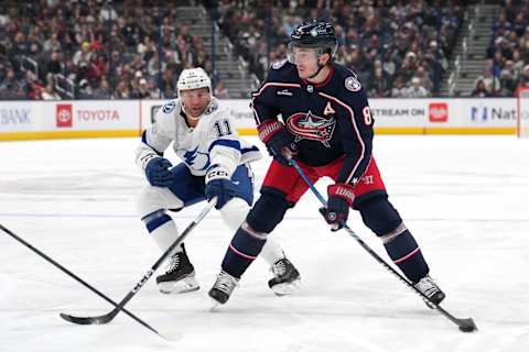 COLUMBUS, OHIO – NOVEMBER 02: Zach Werenski #8 of the Columbus Blue Jackets skates with the puck against Luke Glendening #11 of the Tampa Bay Lightning during the second period at Nationwide Arena on November 02, 2023 in Columbus, Ohio. (Photo by Jason Mowry/Getty Images)