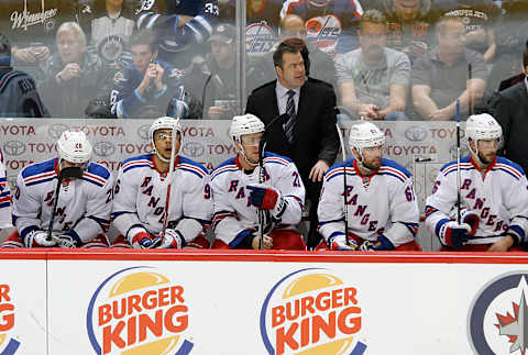 WINNIPEG, MB – DECEMBER 18: Head Coach Alain Vigneault of the New York Rangers looks on from the bench during second period action against the Winnipeg Jets at the MTS Centre on December 18, 2015 in Winnipeg, Manitoba, Canada. (Photo by Darcy Finley/NHLI via Getty Images)