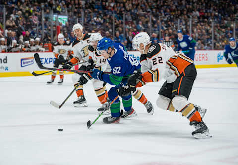 Nov 9, 2021; Vancouver, British Columbia, CAN; Anaheim Ducks forward Adam Henrique (14) and defenseman Kevin Shattenkirk (22) check Vancouver Canucks forward Vasily Podkolzin (92) in the third period at Rogers Arena. Ducks won 3-2 in Overtime. Mandatory Credit: Bob Frid-USA TODAY Sports