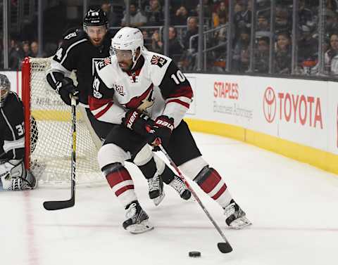 Apr 2, 2017; Los Angeles, CA, USA; Arizona Coyotes left wing Anthony Duclair (10) controls the puck against Los Angeles Kings defenseman Derek Forbort (24) in the first period of the game at Staples Center. Mandatory Credit: Jayne Kamin-Oncea-USA TODAY Sports