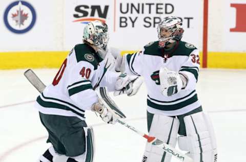 WINNIPEG, MANITOBA – APRIL 20: Alex Stalock #32 of the Minnesota Wild replaces teammate Devan Dubnyk #40 in Game Five of the Western Conference First Round during the 2018 NHL Stanley Cup Playoffs against the Winnipeg Jets on April 20, 2018 at Bell MTS Place in Winnipeg, Manitoba, Canada. (Photo by Jason Halstead /Getty Images)