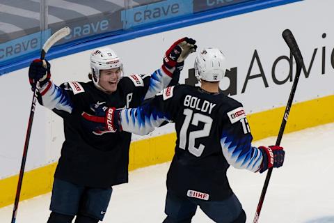 EDMONTON, AB – DECEMBER 29: Cole CAUFIELD #13 and Matthew Boldy #12 of the United States celebrate a goal against the Czech Republic during the 2021 IIHF World Junior Championship at Rogers Place on December 29, 2020 in Edmonton, Canada. (Photo by Codie McLachlan/Getty Images)