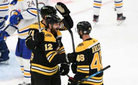 Apr 13, 2021; Boston, Massachusetts, USA; Boston Bruins right wing Craig Smith (12) celebrates with center David Krejci (46) after scoring against the Buffalo Sabres during the second period at TD Garden. Mandatory Credit: Brian Fluharty-USA TODAY Sports