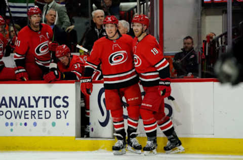 RALEIGH, NC – JANUARY 7: Jake Gardiner #51 of the Carolina Hurricanes celebrates with teammate Dougie Hamilton #19 after scoring a goal during an NHL game against the Philadelphia Flyers on January 7, 2020 at PNC Arena in Raleigh, North Carolina. (Photo by Gregg Forwerck/NHLI via Getty Images)