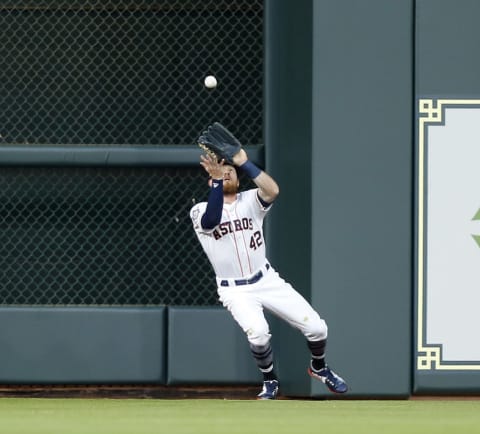 HOUSTON, TX – APRIL 15: Derek Fisher #21 of the Houston Astros catches a fly ball by Adrian Beltre #29 of the Texas Rangers in the second inning at Minute Maid Park on April 15, 2018 in Houston, Texas. All players are wearing #42 in honor of Jackie Robinson Day. (Photo by Bob Levey/Getty Images)