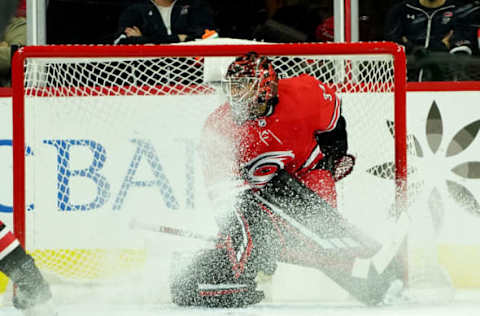 RALEIGH, NC – OCTOBER 29: Petr Mrazek #34 of the Carolina Hurricanes gets snowed in the crease during an NHL game against the Calgary Flames on October 29, 2019 at PNC Arena in Raleigh, North Carolina. (Photo by Gregg Forwerck/NHLI via Getty Images)