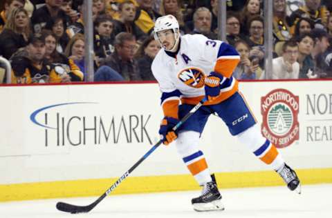 Mar 24, 2017; Pittsburgh, PA, USA; New York Islanders defenseman Travis Hamonic (3) skates with puck against the Pittsburgh Penguins during the third period at the PPG PAINTS Arena. The Islanders won 4-3 in a shootout. Mandatory Credit: Charles LeClaire-USA TODAY Sports