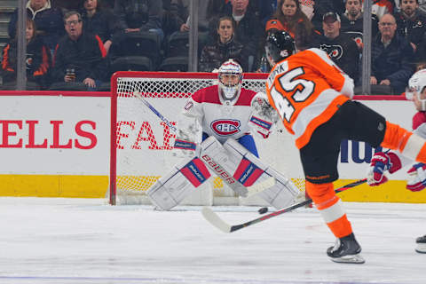 Cam York of the Philadelphia Flyers shoots the puck at Cayden Primeau. (Photo by Mitchell Leff/Getty Images)