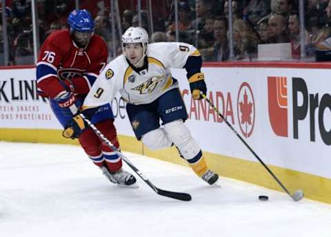 Feb 22, 2016; Montreal, Quebec, CAN; Nashville Predators forward Filip Forsberg (9) plays the puck as Montreal Canadiens defenseman P.K. Subban (76) defends during the second period at the Bell Centre. Mandatory Credit: Eric Bolte-USA TODAY Sports