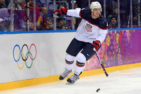 US John Carlson controls the puck during the Men’s Ice Hockey Semifinal match between the USA and Canada at the Bolshoy Ice Dome during the Sochi Winter Olympics on February 21, 2014. AFP PHOTO / JONATHAN NACKSTRAND (Photo credit should read JONATHAN NACKSTRAND/AFP/Getty Images)