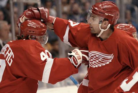 Henrik Zetterberg #40 and Patrick Boileau #27 of the Detroit Red Wings (Photo by Victor Decolongon/Getty Images/NHLI)