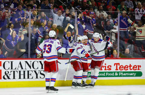 RALEIGH, NC – MARCH 23: Mika Zibanejad #93, Vladimir Tarasenko #91, Adam Fox #23, and Niko Mikkola #77 of the New York Rangers celebrate a goal during the third period of the game against the Carolina Hurricanes at PNC Arena on March 23, 2023, in Raleigh, North Carolina. (Photo by Jaylynn Nash/Getty Images)