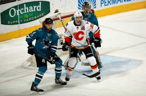 SAN JOSE, CA – APRIL 8: Brenden Dillon #4 and Aaron Dell #30 of the San Jose Sharks along with Troy Brouwer #36 of the Calgary Flames. (Photo by Scott Dinn/NHLI via Getty Images)