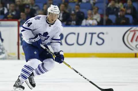 Mar 31, 2016; Buffalo, NY, USA; Toronto Maple Leafs defenseman Morgan Rielly (44) skates with the puck against the Buffalo Sabres during the third period at First Niagara Center. The Sabres won 4-1. Mandatory Credit: Kevin Hoffman-USA TODAY Sports